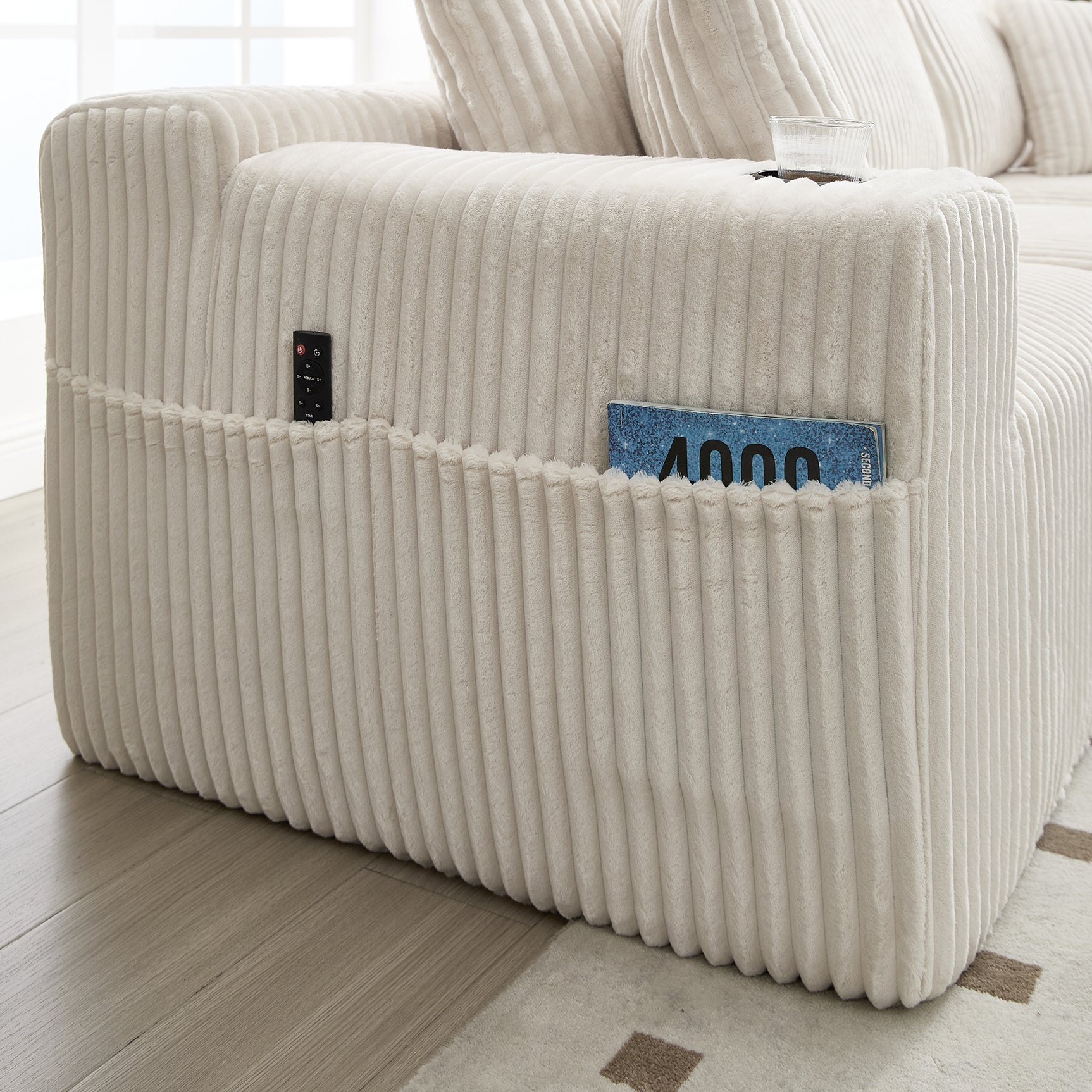 2-seater sofa bed in dark gray fabric with side pockets, modern convertible sofa