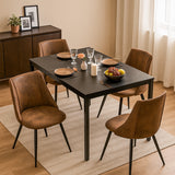 Ensemble table à manger extensible noire avec 4 fauteuils en suédine, style scandinave